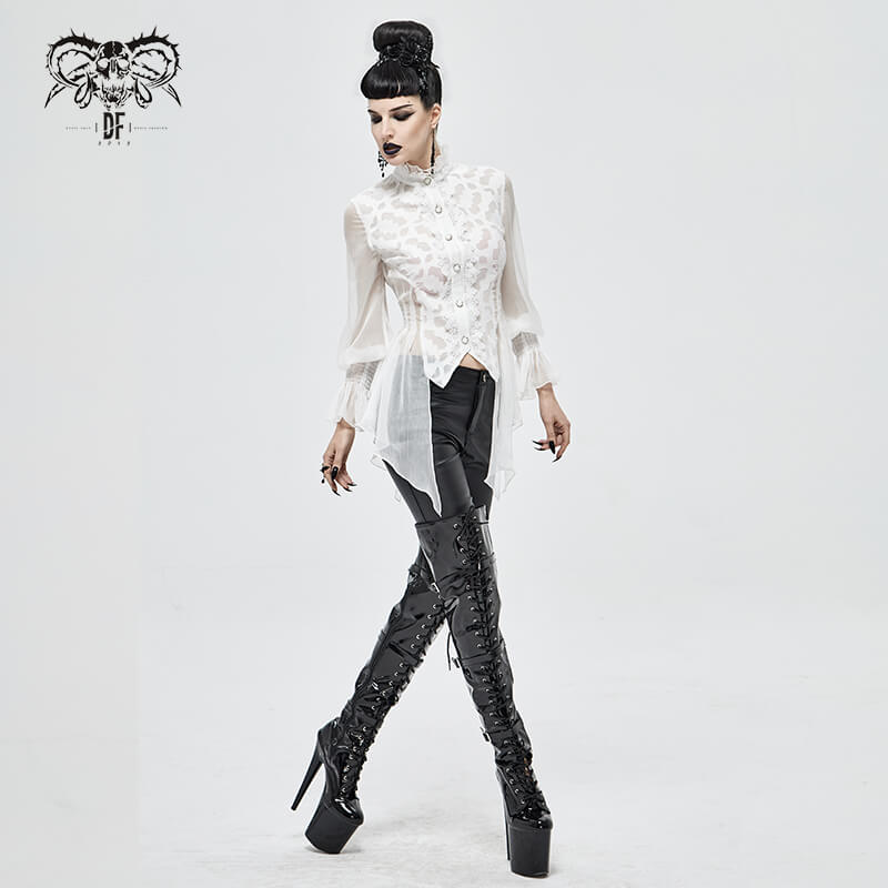 Elegant gothic white chiffon blouse with lace details, styled with high-waisted black pants and bold thigh-high boots.