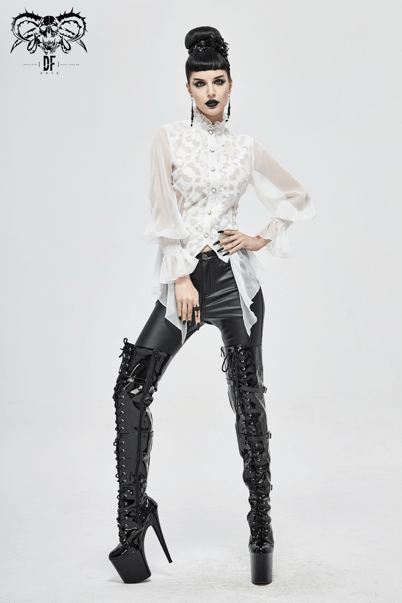 Model showcasing a vintage chiffon lace petal sleeve blouse in white, paired with edgy black leather pants and high boots.