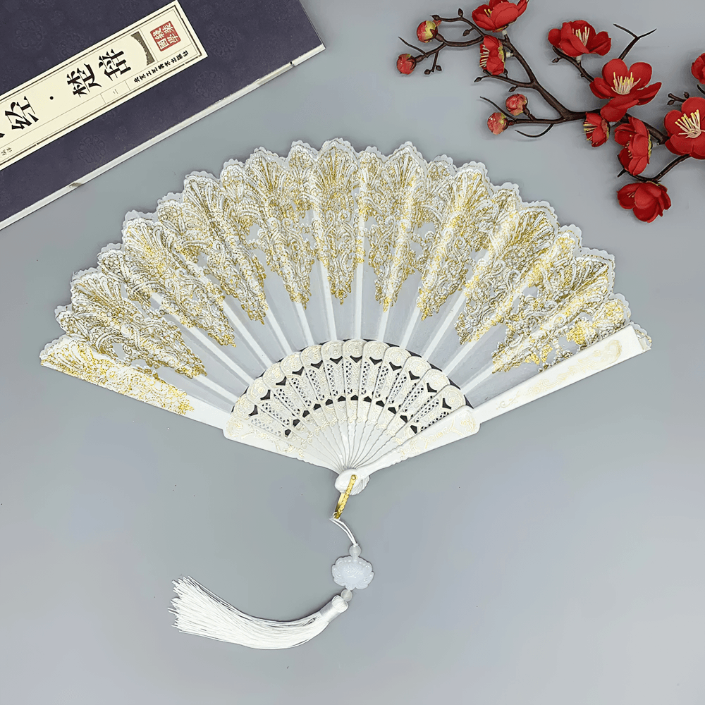 Vintage Chinese Lace Folding Fan with Tassel Detail featuring intricate floral lace and ornate gold detailing.