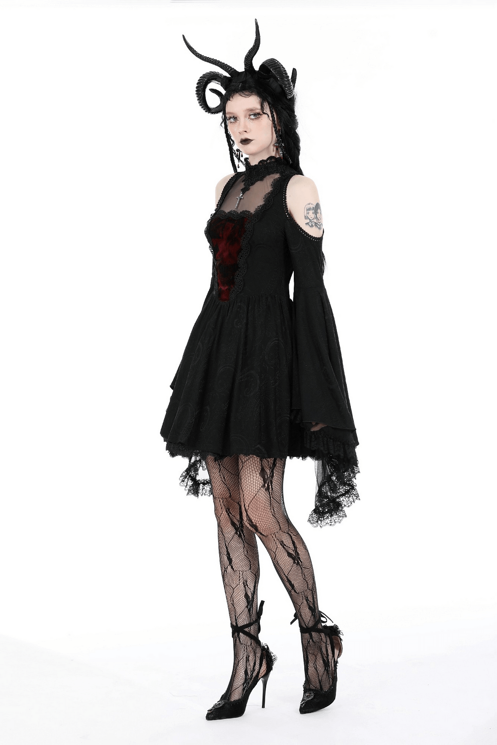 Gothic cold shoulder dress with flared lace sleeves and heart-shaped burgundy inset, paired with stylish fishnet stockings.