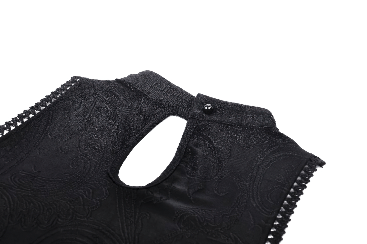 Close-up of the back detail of a vintage gothic cold shoulder dress, featuring intricate lace and a keyhole button design.