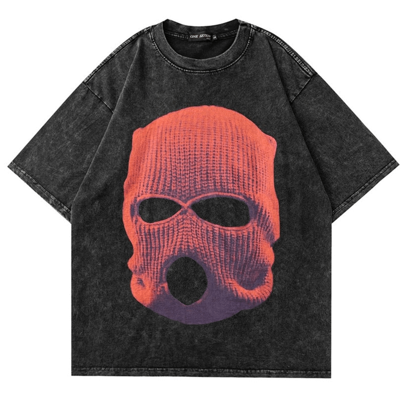 Black oversized t-shirt featuring a bold orange and purple knitted mask graphic design.