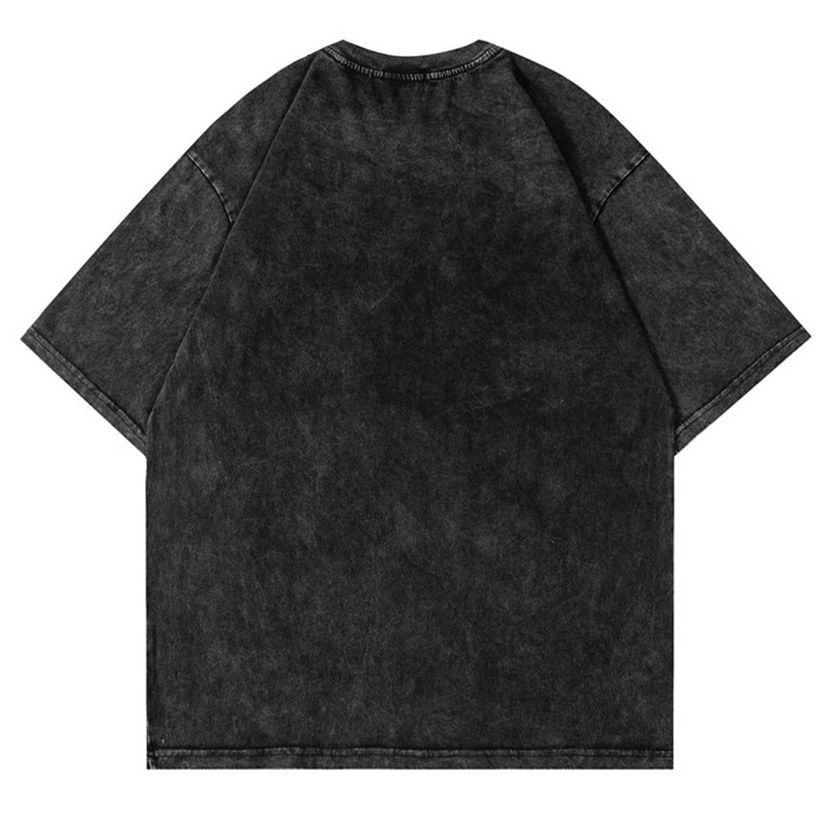 Back view of a vintage black cotton t-shirt with a relaxed fit, showcasing a stylish retro design.