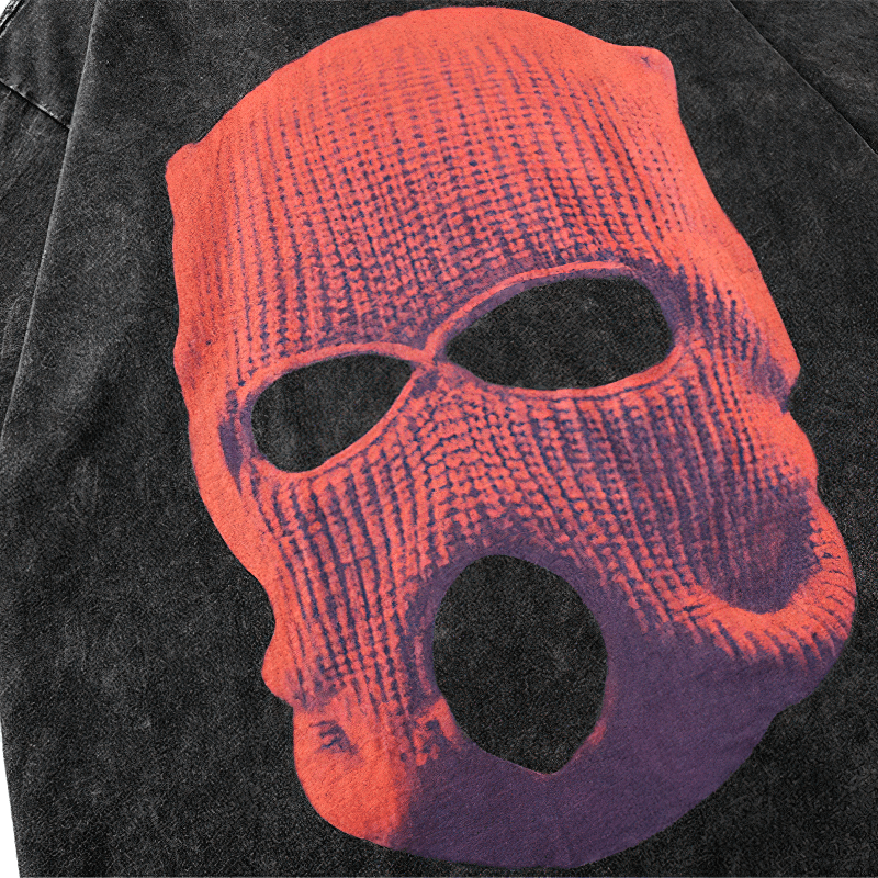 Close-up of artistic skull graphic on black cotton t-shirt, showcasing detailed vintage-inspired print.