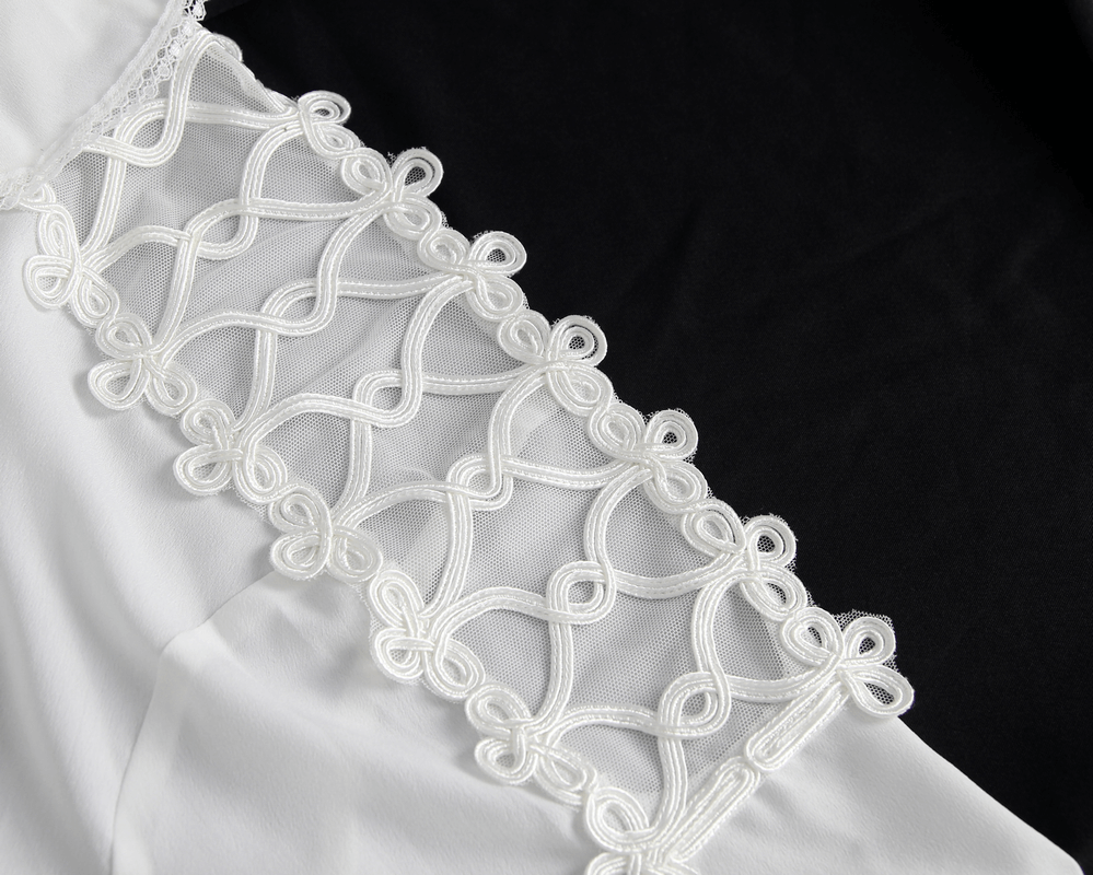 Close-up of vintage shirt sleeve with intricate white ruffle detailing, showcasing stylish design.