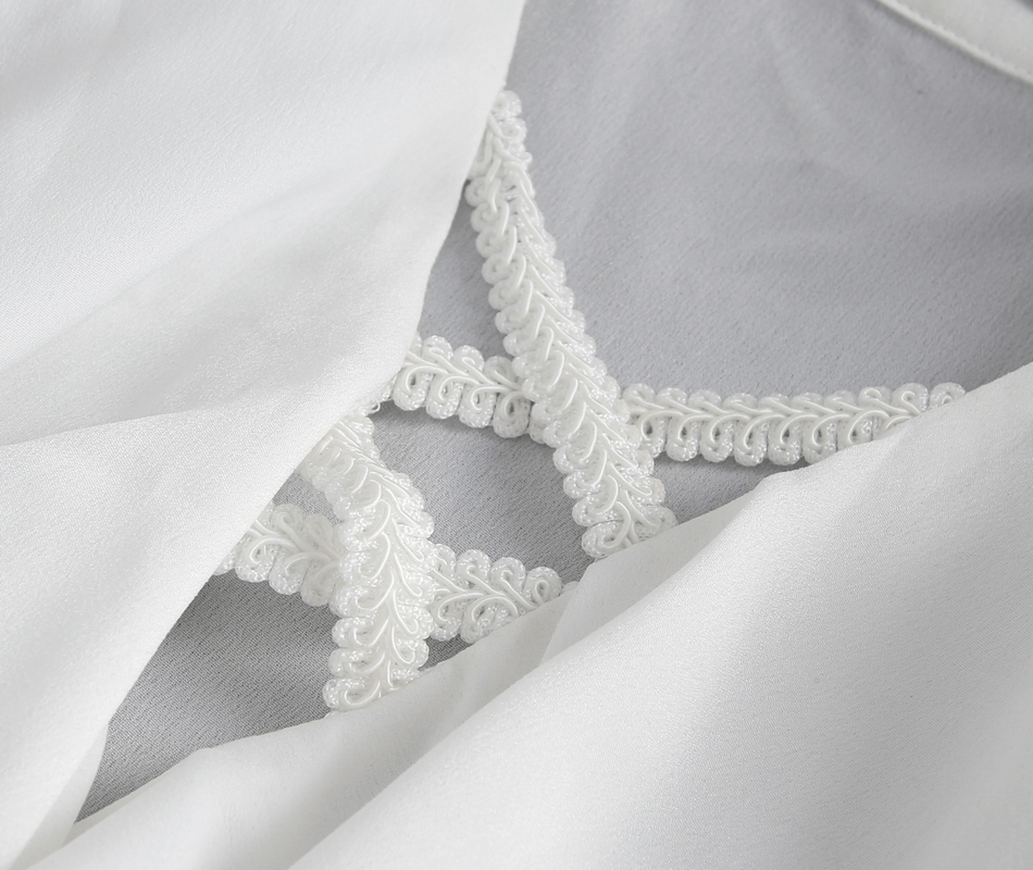 Close-up of white fabric showing intricate lace detailing and soft drape for a vintage-inspired shirt.