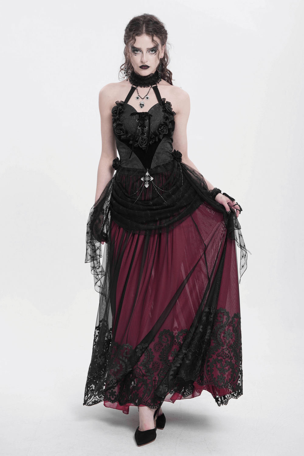 Model wearing a vintage gothic wine red mesh maxi skirt with embroidered detailing and a flowing black overlay.