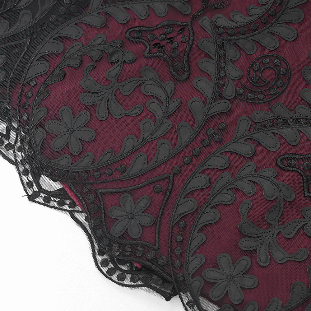 Close-up of vintage gothic embroidered mesh in wine red with black floral design, ideal for a dramatic maxi skirt.