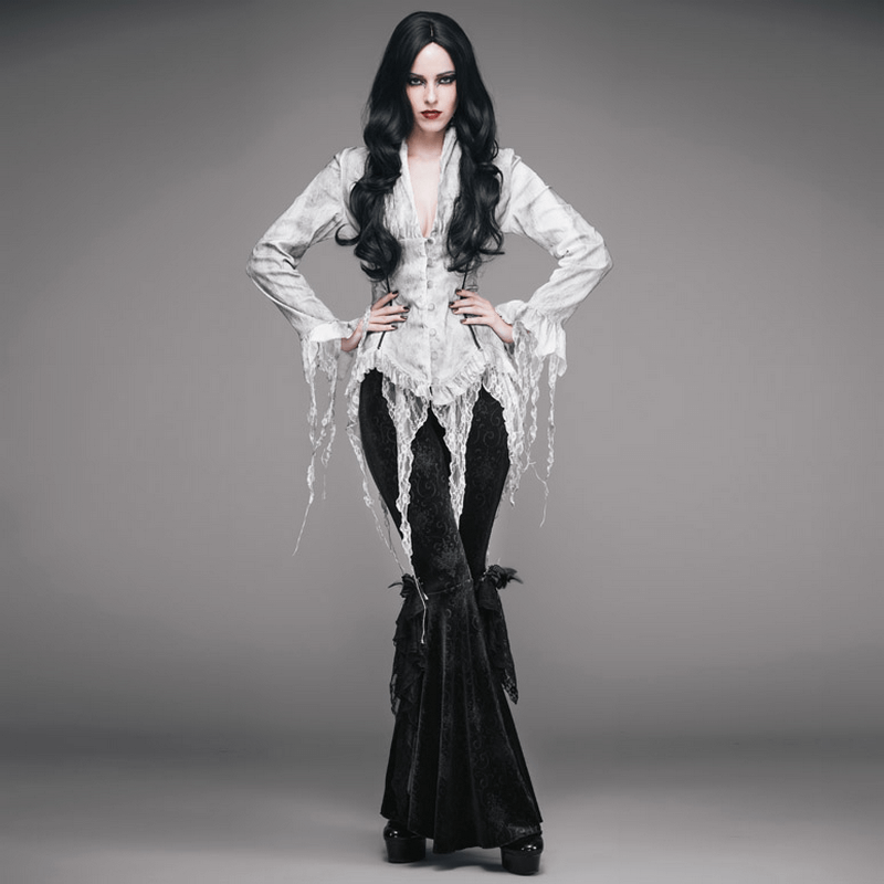 Model wearing a vintage white deep V chiffon blouse with lace inserts and black gothic flared pants.