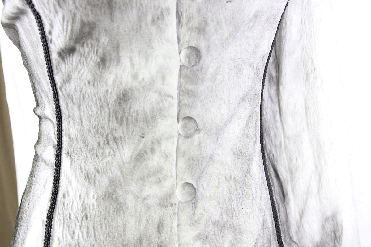 Close-up of vintage white deep V blouse for women featuring elegant buttons and lace detailing, perfect for gothic style.