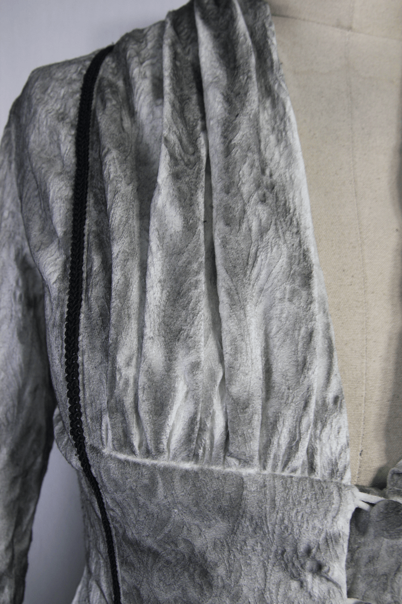 Elegant gray blouse with textured fabric and black detailing, showcasing gothic vintage style for women's fashion.