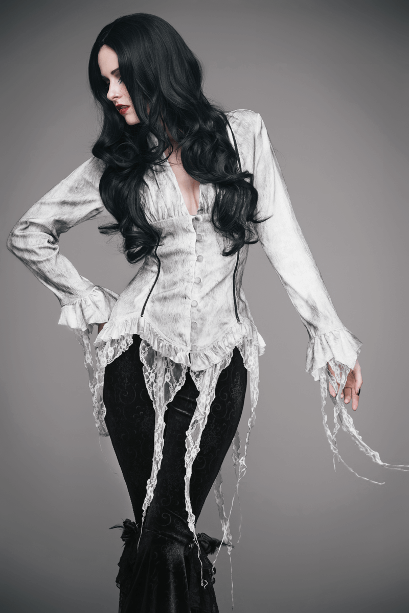 Vintage white deep V blouse for women, featuring lace details and a gothic style, paired with dark pants.