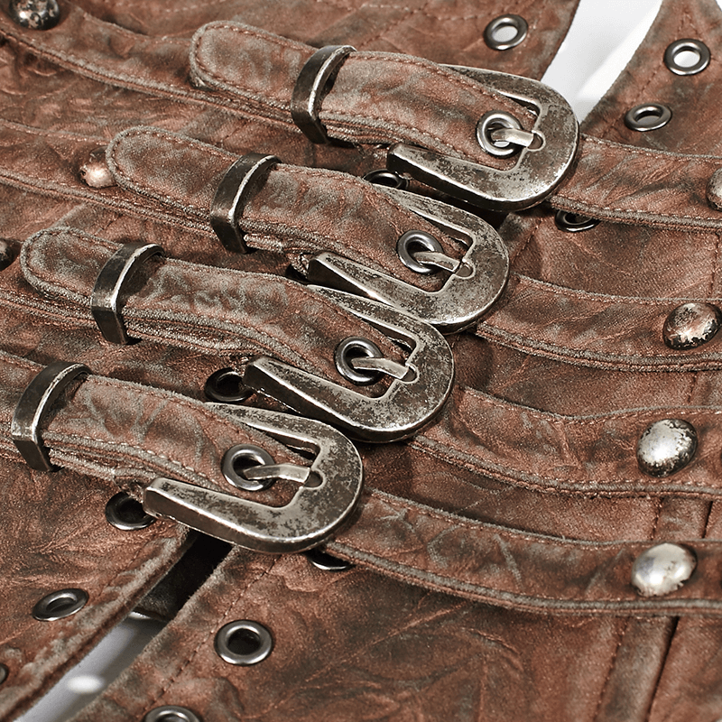 Close-up of vintage female corset belt featuring chic metal buckles and rivets, showcasing a distressed bronze fabric.
