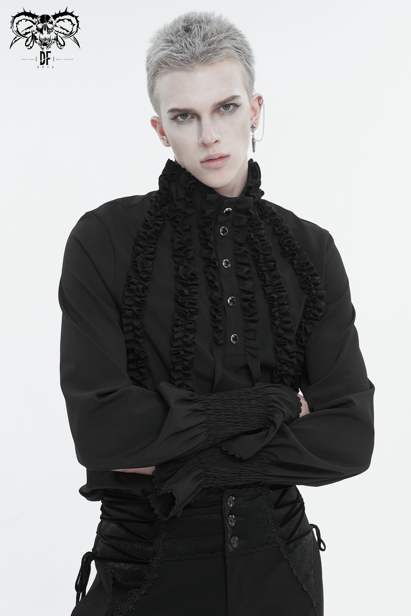 Model wearing a vintage black frilly long sleeve shirt featuring ruffled cuffs and button front, exuding timeless elegance.