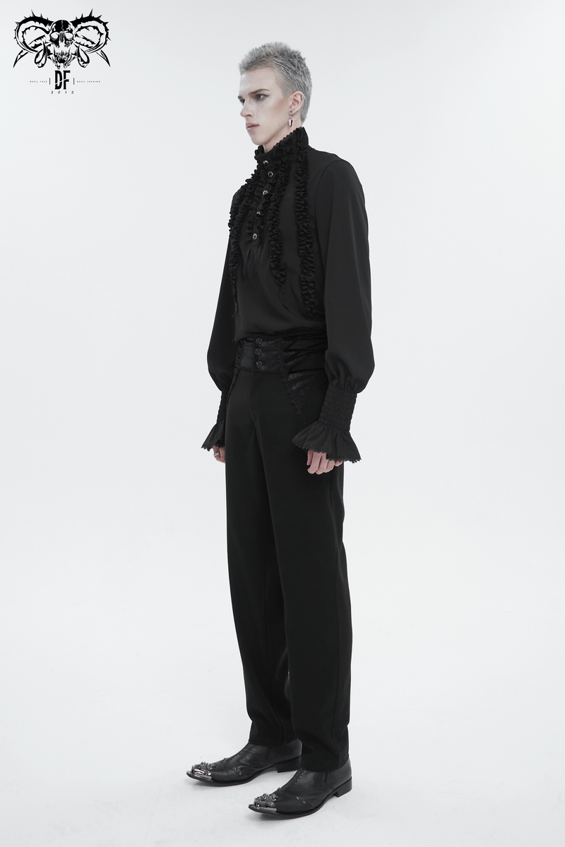 Vintage black shirt with frilly long sleeves and ruffled cuffs, showcasing bold fashion style for men.