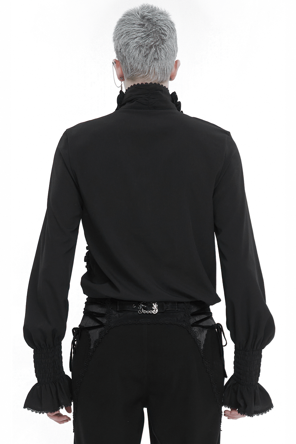 Back view of a vintage black frilly long sleeve shirt with ruffled cuffs, styled for men's fashion.