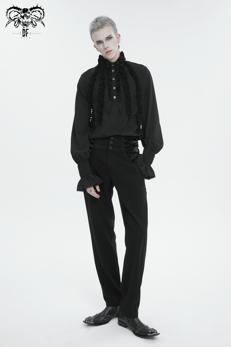 Stylish vintage black shirt with ruffled cuffs and buttons, worn by a model, showcasing timeless elegance.