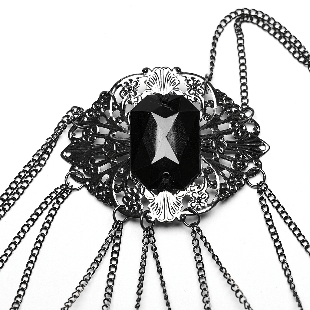 Vintage gothic finger bracelet featuring a rose buckle and black gem centerpiece with tassel chains.