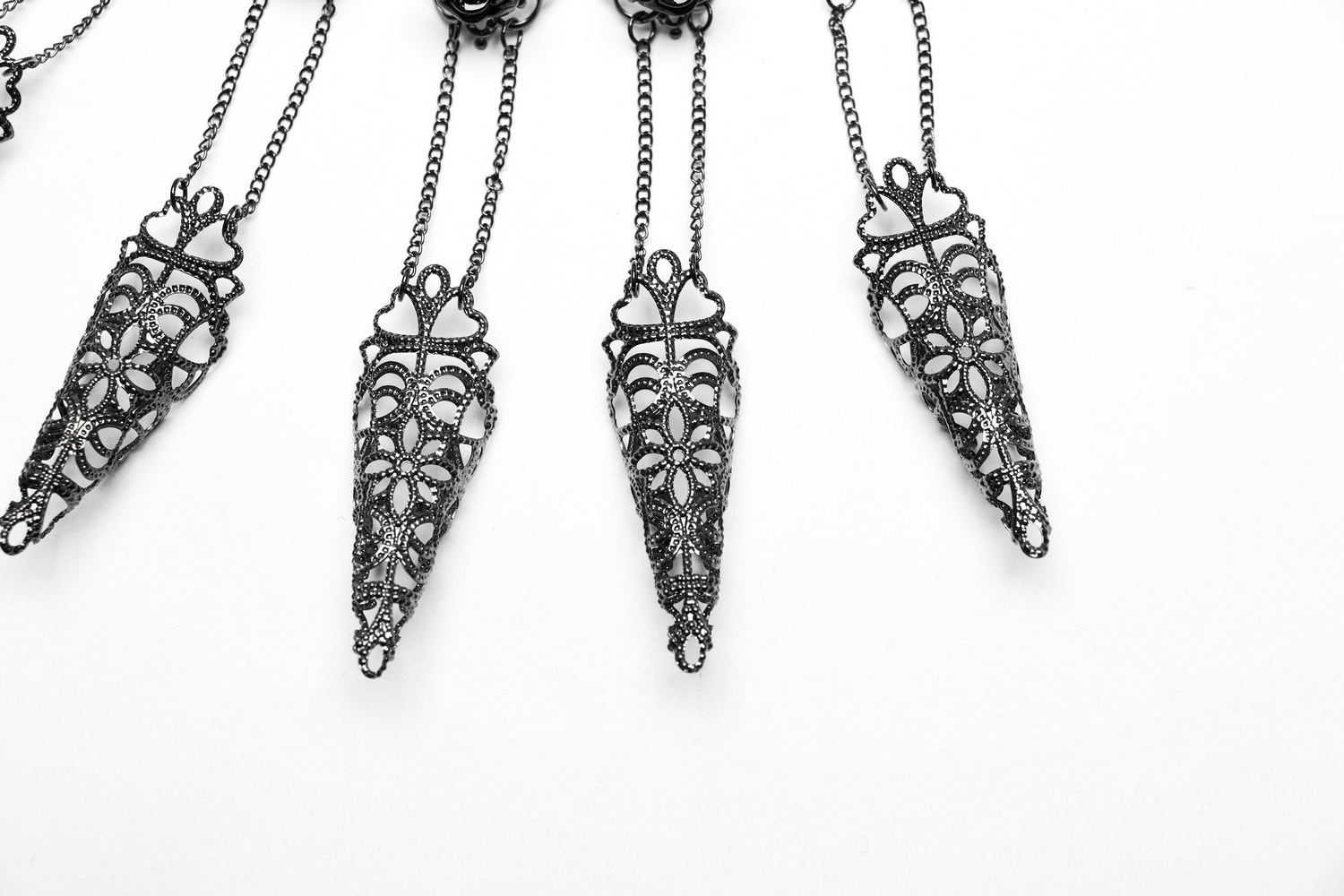 Vintage gothic finger bracelet with elegant tassel details and rose clasp design, perfect for bold fashion statements.