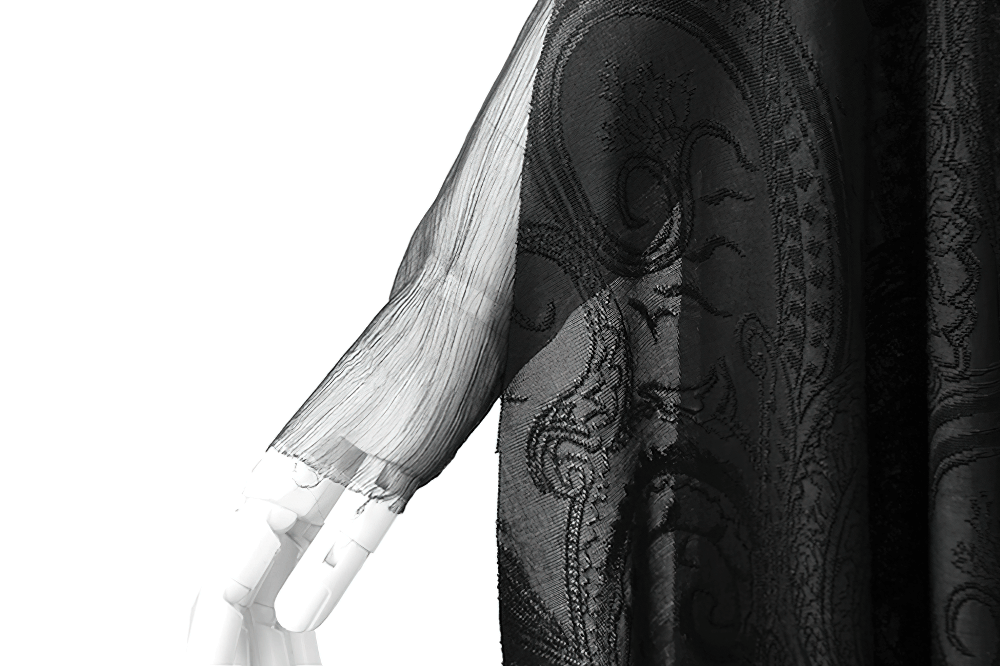 Detail of elegant vintage gothic hooded cape sleeve, showing intricate embroidery and flowing fabric.