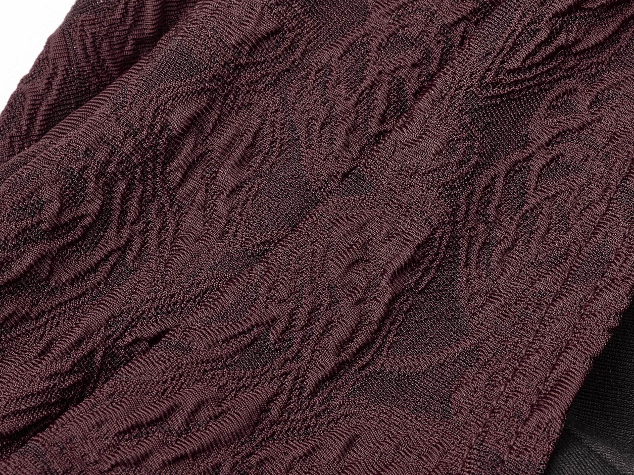 Textured burgundy fabric with intricate rose patterns, showcasing the elegant design of a Gothic long sleeve top.