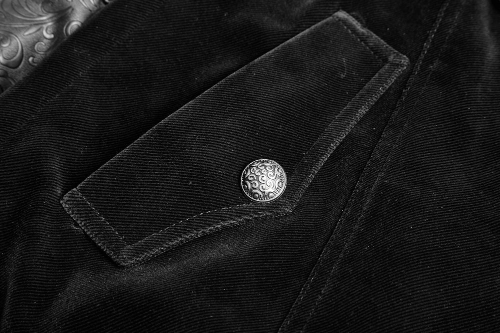 Close-up of vintage gothic velvet cloak showcasing leather accents and ornate button detail.