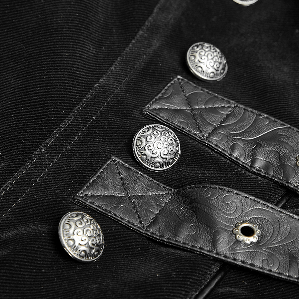 Close-up of vintage gothic male velvet cloak's intricate silver buttons and leather accents, showcasing unique design.