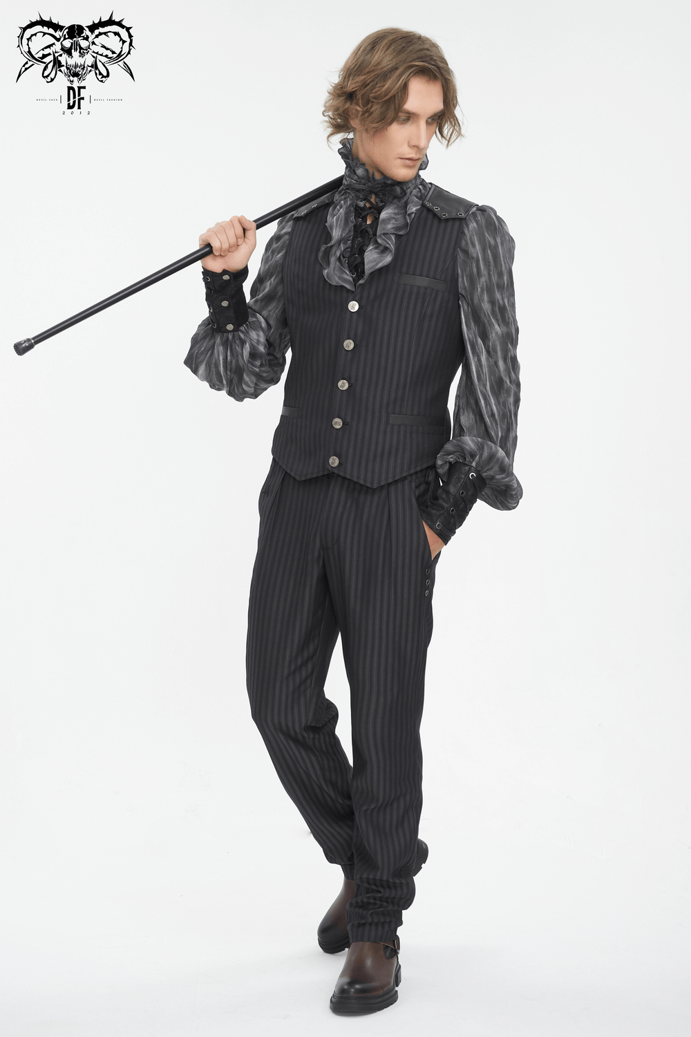 Stylish man in vintage gothic striped waistcoat, showcasing a sleek business look for modern sophistication.