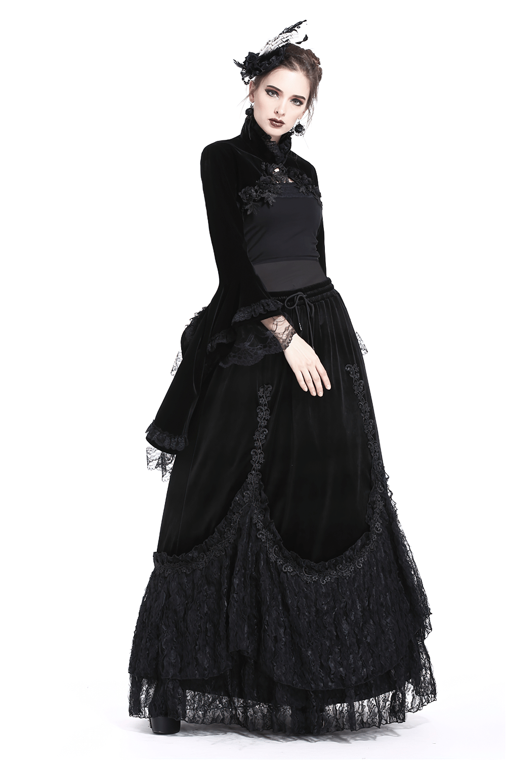 Vintage Gothic velvet bolero with lace sleeves styled with a dramatic black skirt, showcasing Victorian elegance.