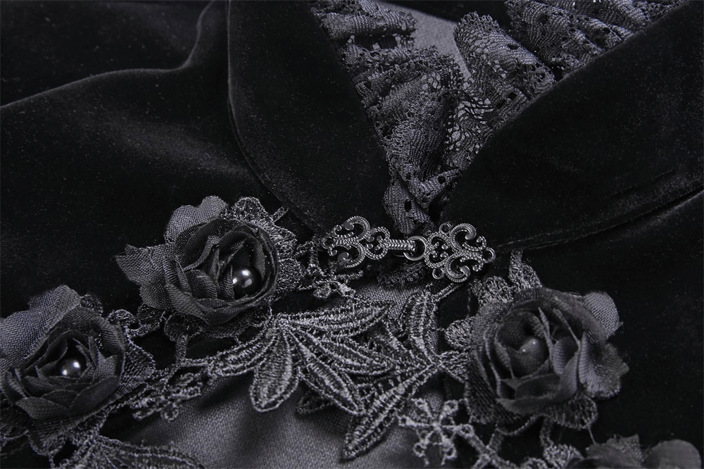 Close-up of a vintage gothic velvet bolero with intricate lace and rose details, perfect for dark fashion lovers.