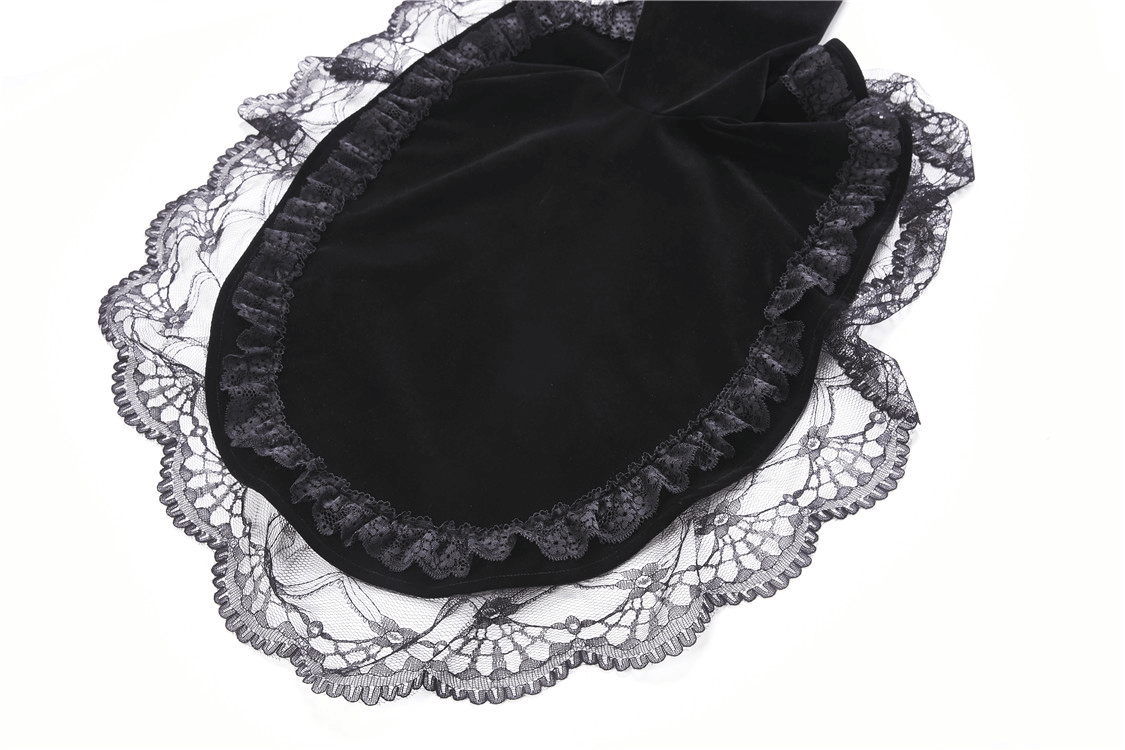 Close-up of vintage black velvet bolero with delicate lace trim, perfect for gothic fashion enthusiasts.