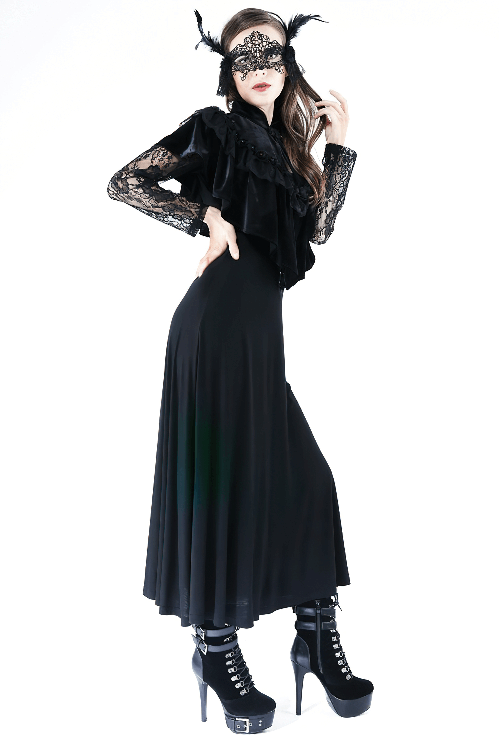Lady in black velvet gothic capelet paired with lace mask and high platform shoes for an elegant spooky look.