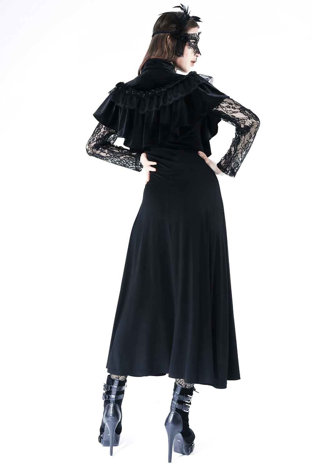 Lady in black wearing a vintage gothic velvet capelet with lace, showcasing elegance and drama in a dark outfit.
