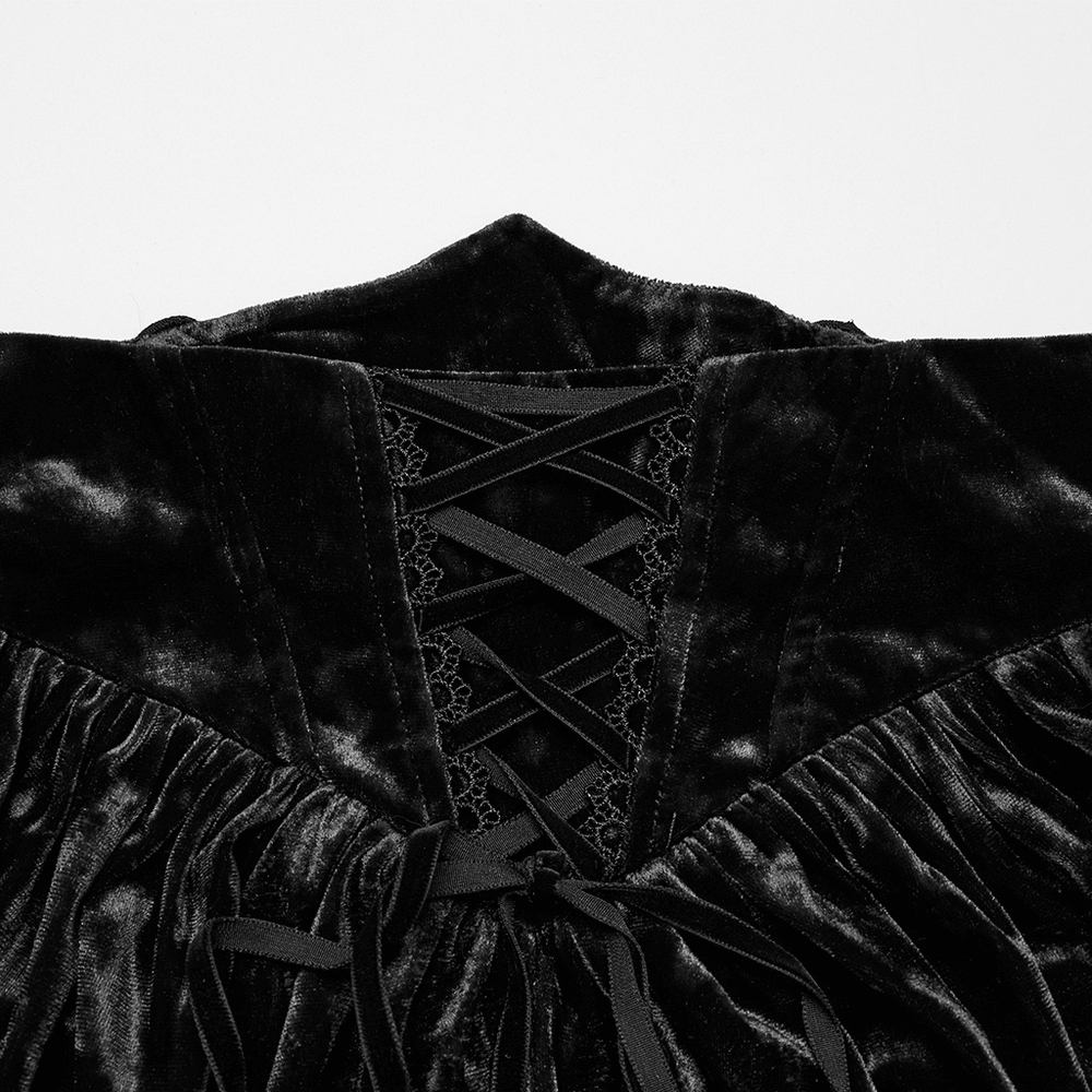 Close-up of vintage gothic velvet skirt back with lace-up design and pleated details, showcasing a luxurious aesthetic.