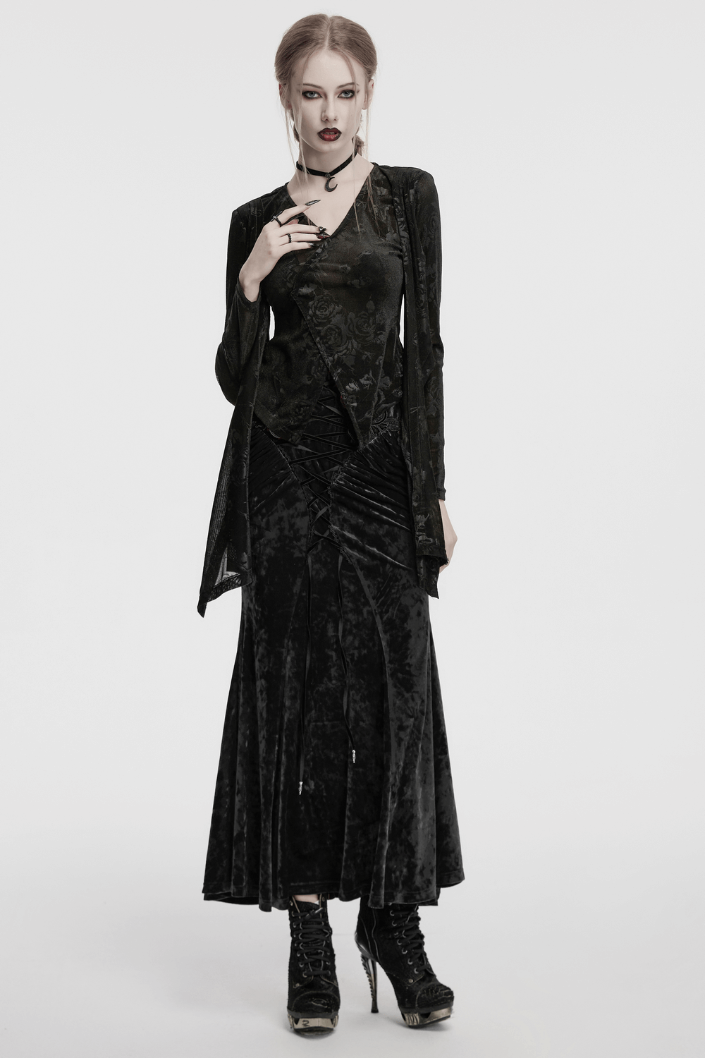 Model wearing a vintage gothic velvet skirt with lace and pleats, styled for a dark, elegant aesthetic.