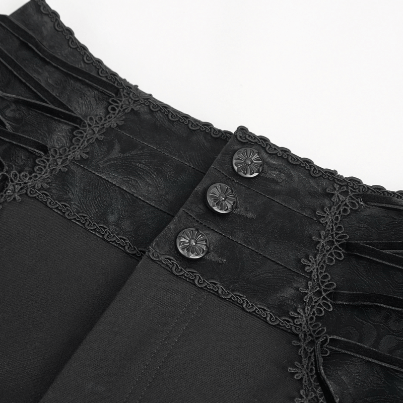Close-up of men's vintage gothic high-waisted pants with intricate lace-up waist and patterned buttons.