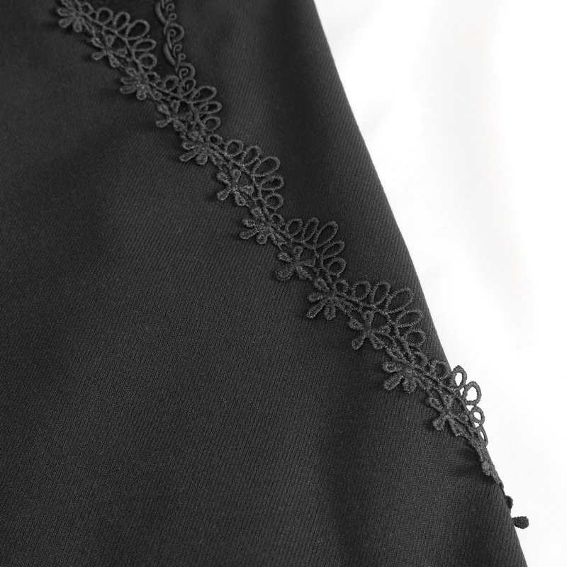 Close-up of black fabric with delicate lace trim, showcasing vintage gothic style and intricate detailing.