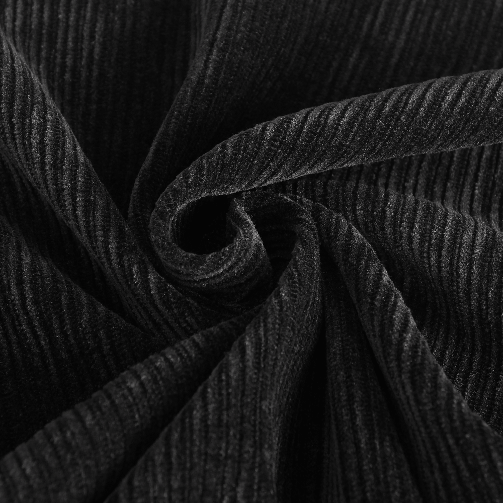 Close-up of plush black corduroy fabric showing soft texture and ridged pattern, perfect for vintage-inspired pants.
