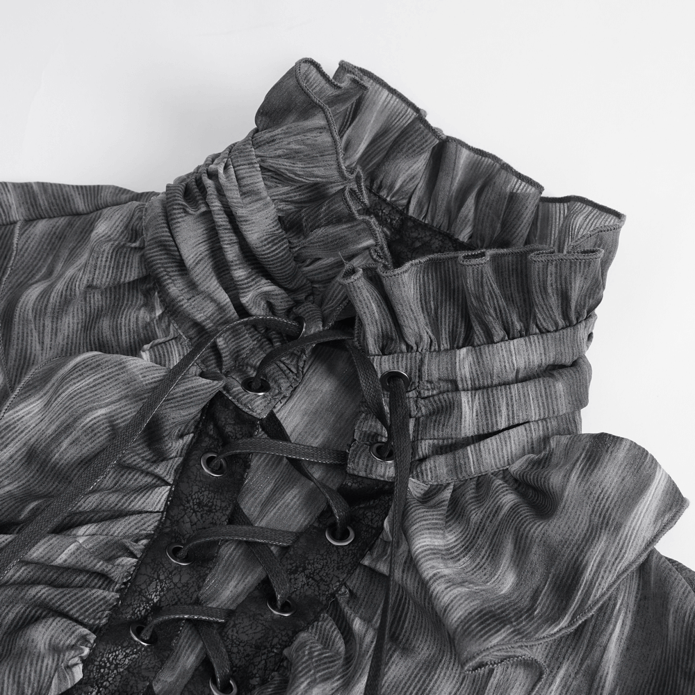 Close-up of a vintage-inspired lace-up ruffle gothic shirt featuring elegant ruffles and textured fabric.