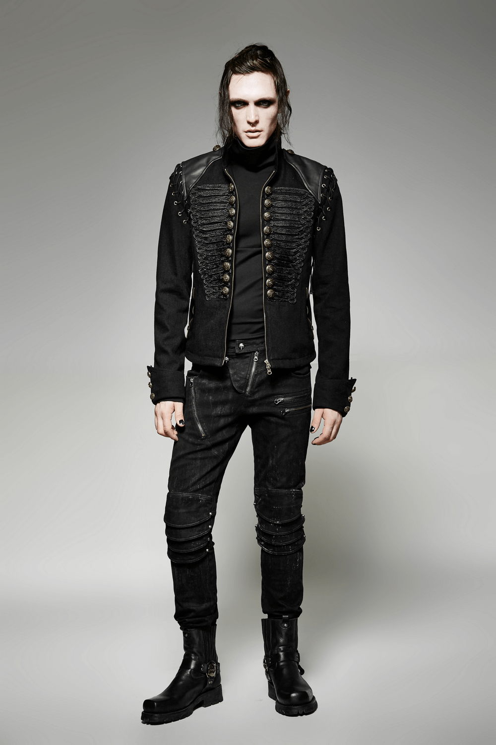 Edgy vintage-inspired military jacket with detachable sleeves, worn by model in black outfit.
