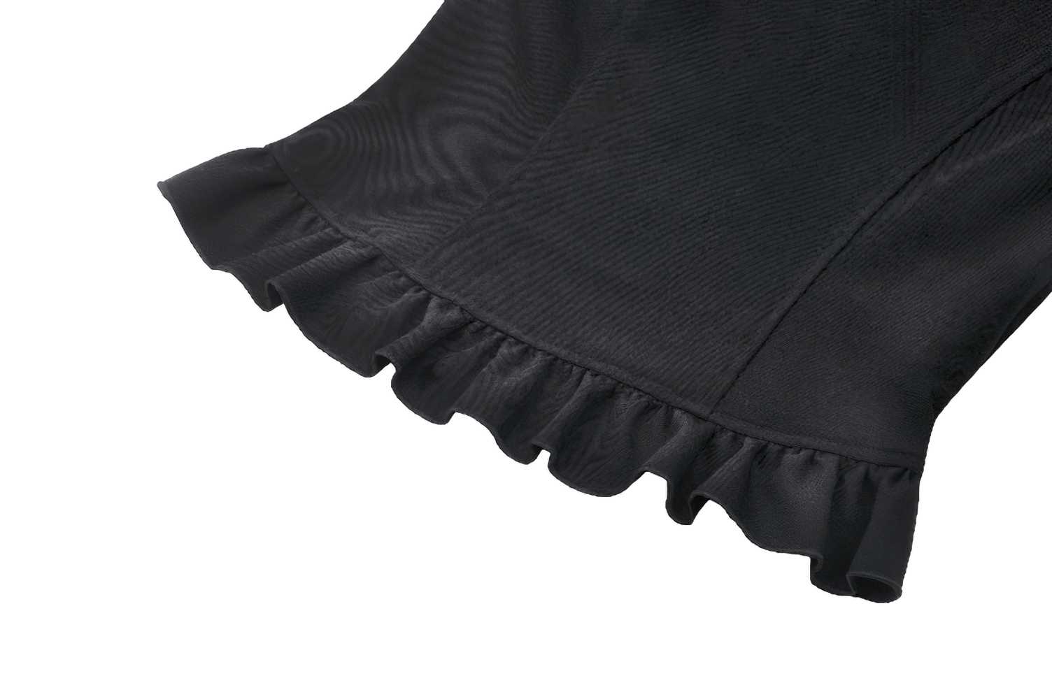 Close-up of the ruffled hem of a vintage black peplum blouse, showcasing elegant lace details.