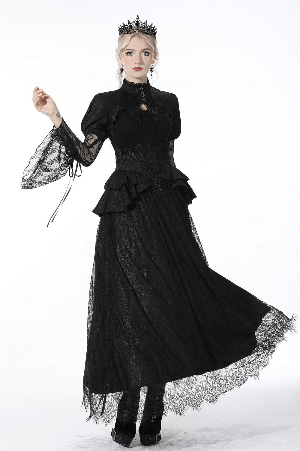Victorian-inspired black lace layered skirt with ruffles and satin ribbon, styled elegantly with gothic flair.
