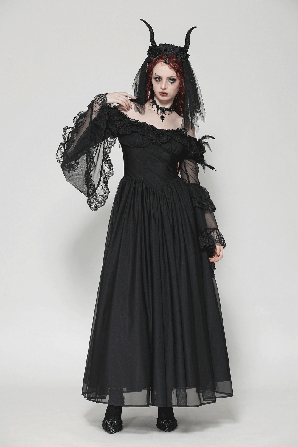 Vintage Gothic dress with lace sleeves and dramatic details, perfect for themed events or evening wear.