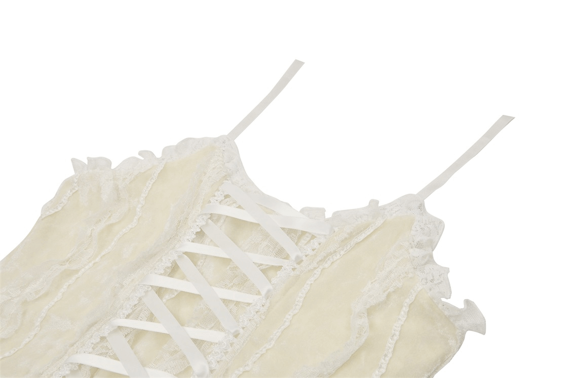 Close-up of a vintage beige lace-up dress with ruffled details and lace accents, perfect for a boho chic look.