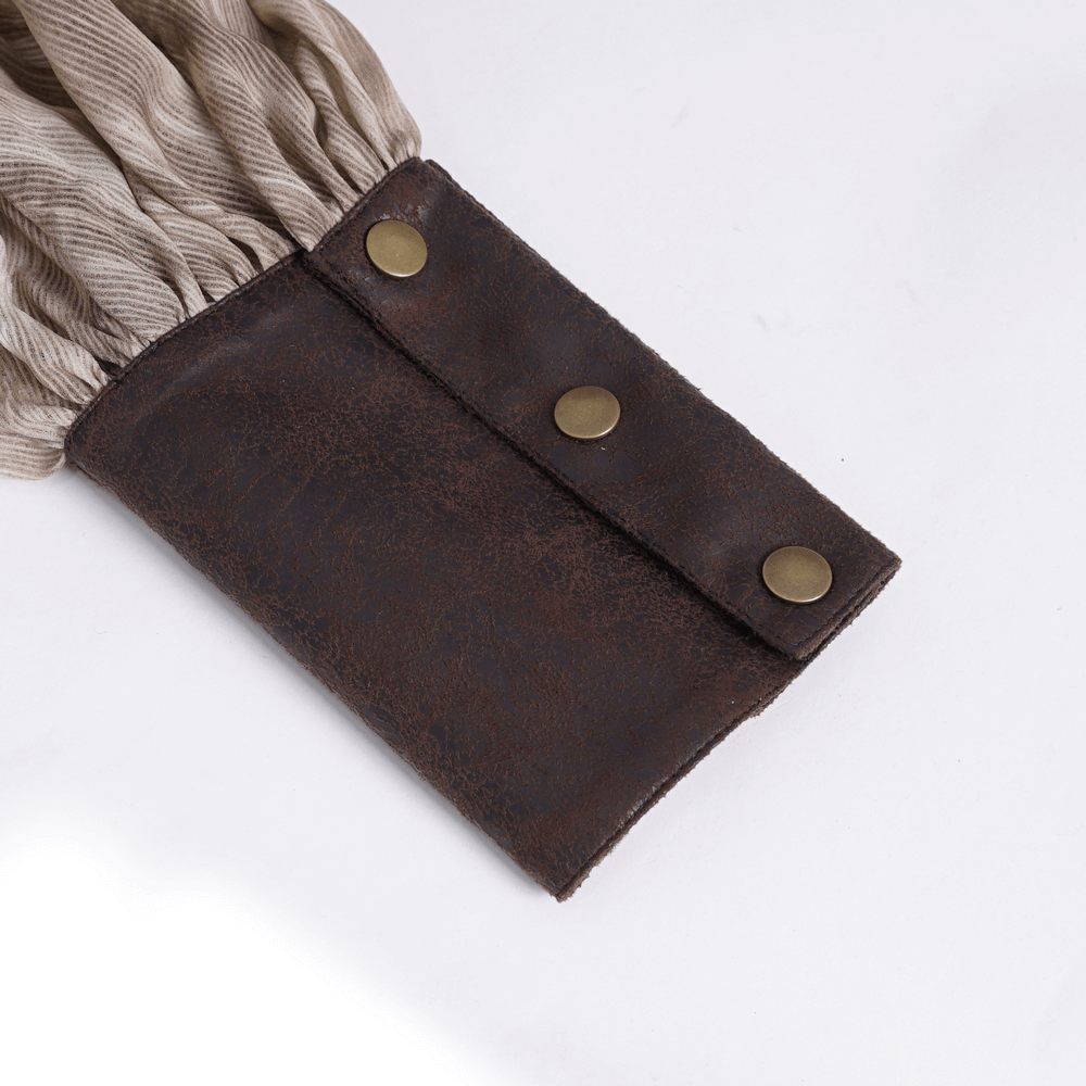 Close-up of ruffled shirt sleeve with brown leather cuff and antique brass buttons, showcasing vintage Gothic style.