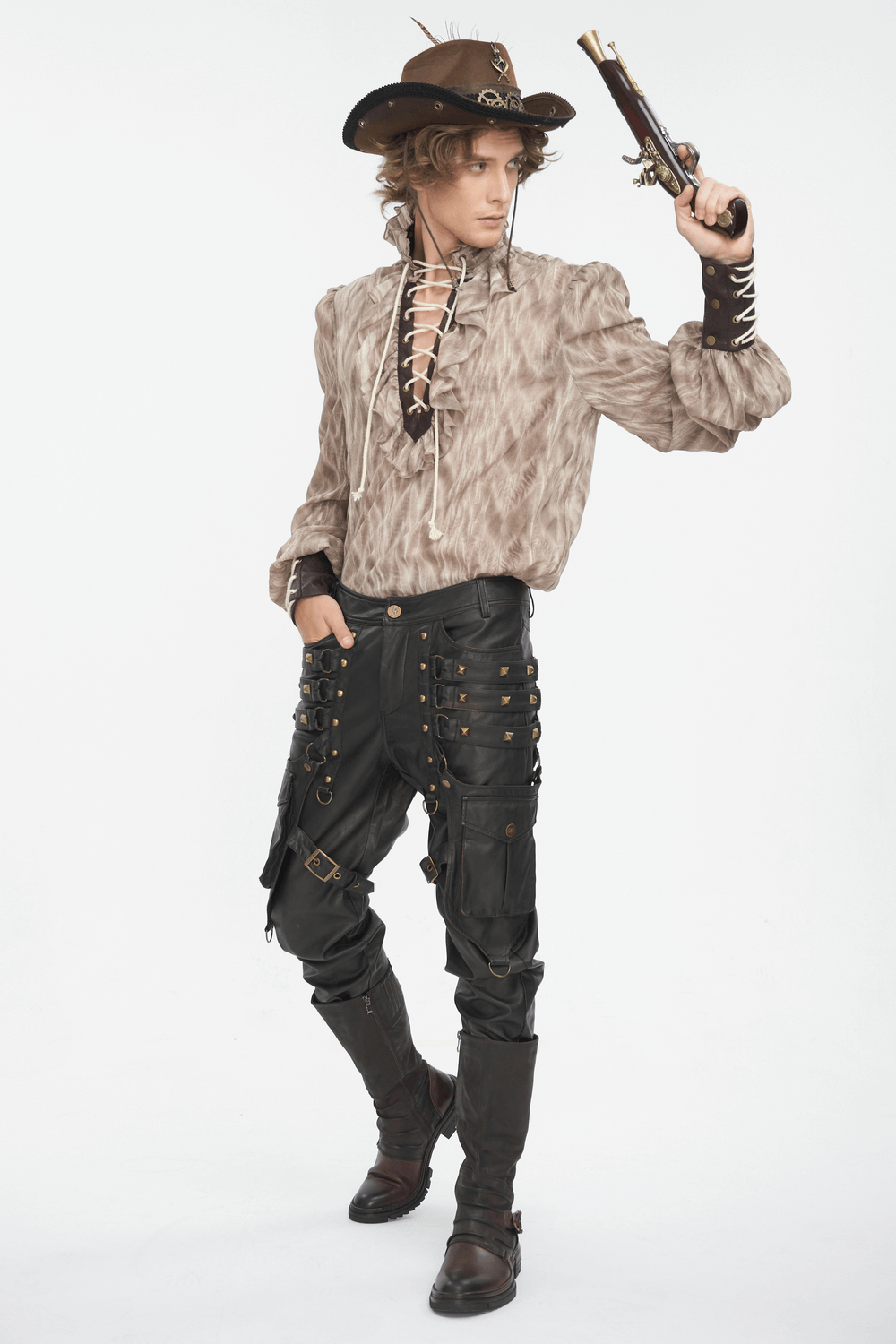 Man wearing a vintage Gothic lace-up shirt with ruffled neck and leather pants, striking a dramatic pose.