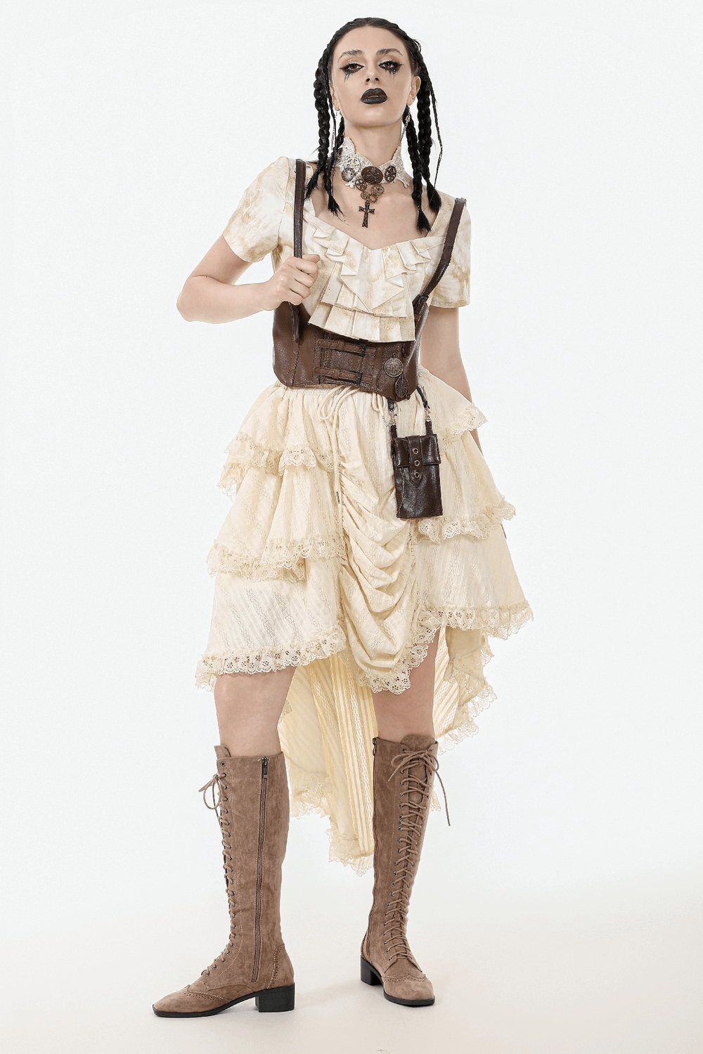Model wearing a vintage cream high-low ruffle skirt with lace trim, paired with boots and accessories for a boho look.