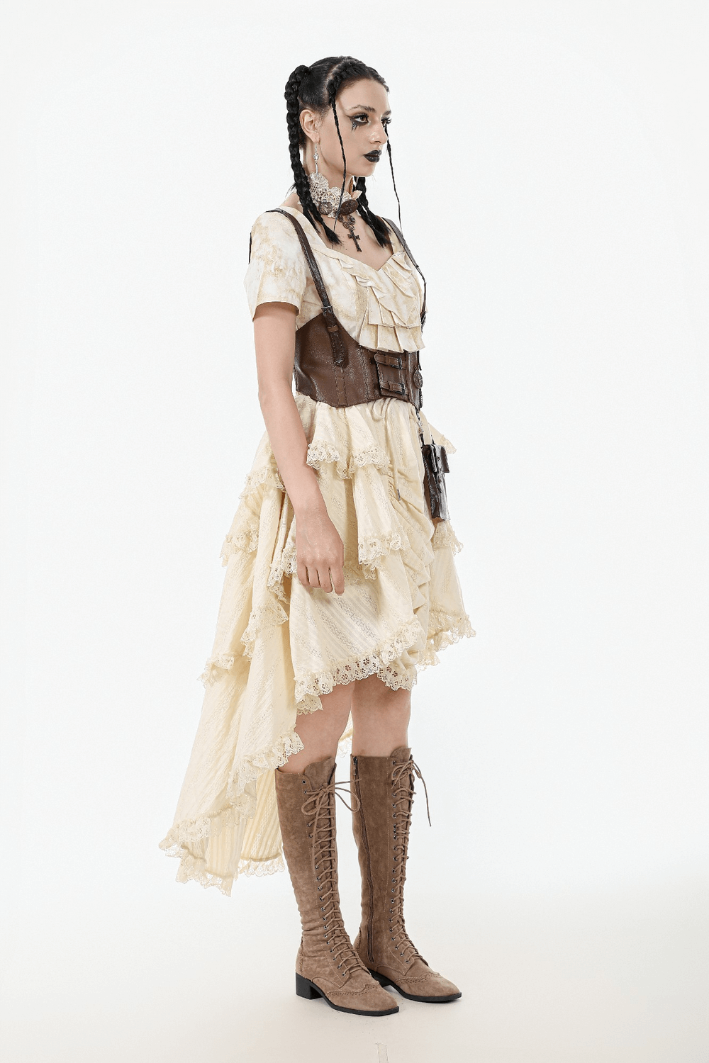 Model in a vintage layered ruffle high-low boho skirt with lace trim, paired with a corset and knee-high boots.