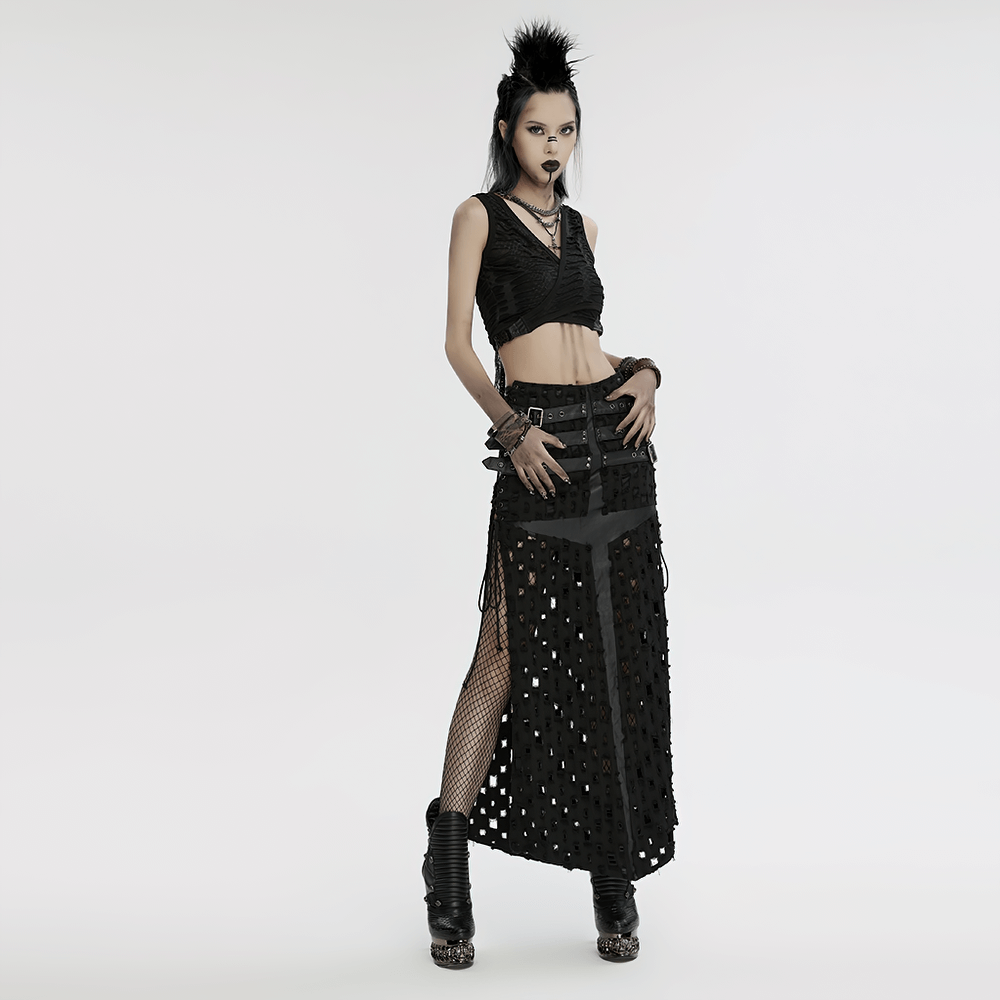 Punk-inspired model showcasing edgy black outfit with mesh detailing and accessories, embodying a rebellious spirit.