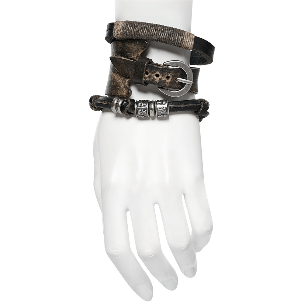 Vintage leather punk bracelet set with skull beads displayed on a mannequin hand, showcasing texture and style.